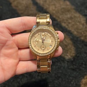 Rose gold fossil watch with rhinestone accents